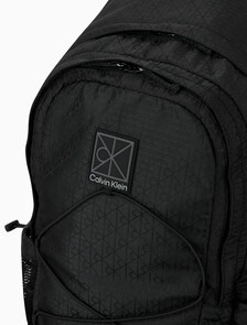 Buy 남녀공용 유틸리티 엠블럼 번지 백팩 in color BLACK