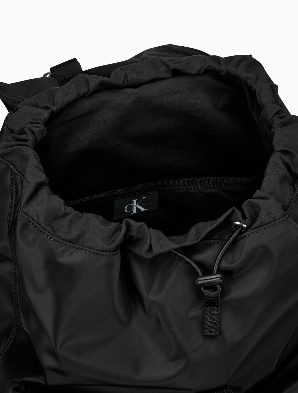Buy CKJ 리버서블 플랩 투포켓 백팩 in color BLACK