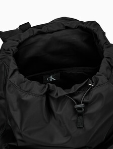 Buy CKJ 리버서블 플랩 투포켓 백팩 in color BLACK