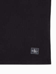 Buy 여성 우븐라벨 슬리브리스 하프 집업 탑 in color BLACK