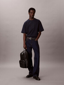 Buy 남성 라지 엠보스드 엠블럼 슬림 스퀘어 백팩 in color BLACK