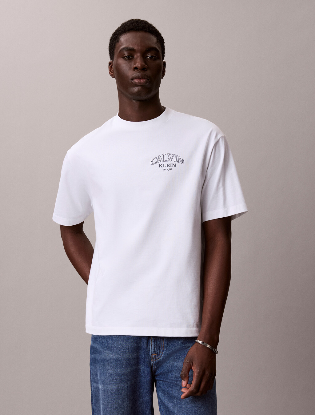 Buy 릴렉스드 저지 엠보스드 모노로고 티 in color BRIGHT WHITE