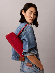 Buy 여성 엠보스드 로고 포일 글로시 발레토 백 in color JUNEBERRY