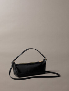 Buy 여성 엠보스드 로고 포일 글로시 콘브 백 in color BLACK