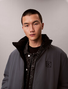 Buy 남성 나일론 리버서블 올오버프린트 다운 푸퍼 자켓 in color BLACK