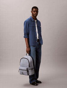 Buy 남녀공용 볼드 로고 나일론 헤더 라운드 백팩 in color Grey