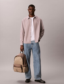 Buy 남녀공용 볼드 로고 컬러블록 라운드 백팩 in color Desert Taupe