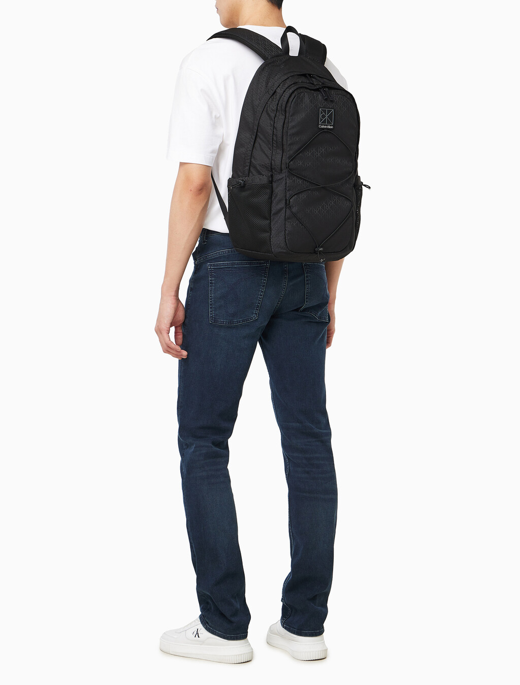 Buy 남녀공용 유틸리티 엠블럼 번지 백팩 in color BLACK