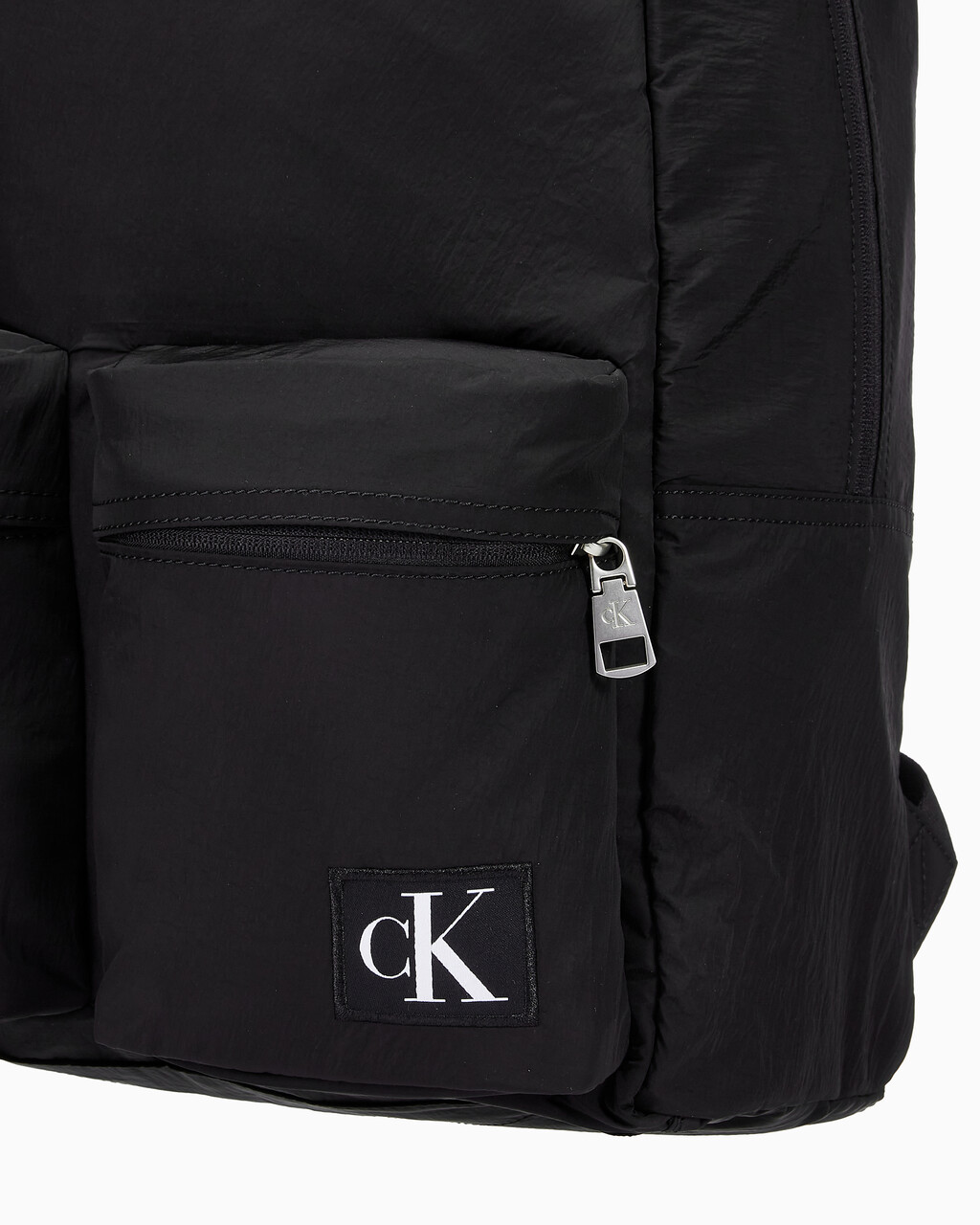 Buy 남녀공용 CKJ 시티 나일론 투 포켓 캠퍼스 백팩 in color BLACK