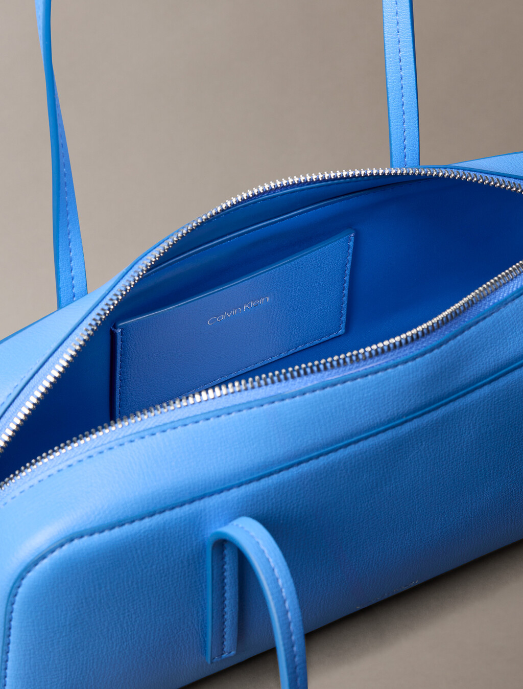 Buy 여성 엠보스드 로고 포일 발레토 백 in color Blue