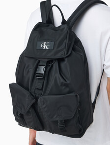 Buy CKJ 리버서블 플랩 투포켓 백팩 in color BLACK