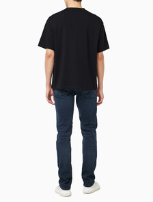 Buy 릴렉스드 저지 엠보스드 모노로고 티 in color BLACK