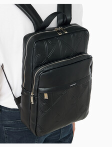 Buy 남성 라지 엠보스드 엠블럼 슬림 스퀘어 백팩 in color BLACK