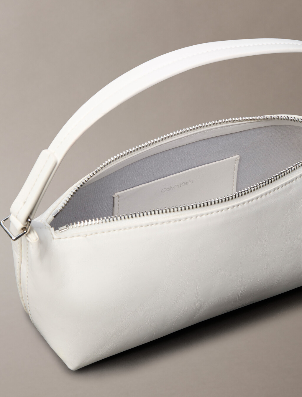 Buy 여성 엠보스드 로고 포일 글로시 콘브 백 in color White Alyssum