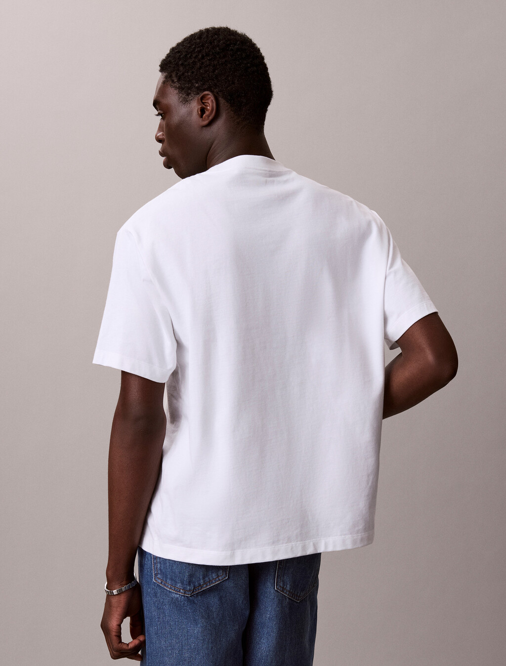 Buy 릴렉스드 저지 엠보스드 모노로고 티 in color BRIGHT WHITE