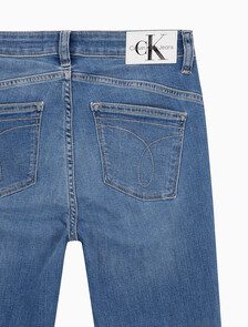 Buy 여성 하이라이즈 바디 슬림핏 부츠컷 미드블루 앵클 데님 in color MID BLUE BACK EMBRO