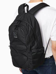 Buy 남녀공용 유틸리티 엠블럼 번지 백팩 in color BLACK