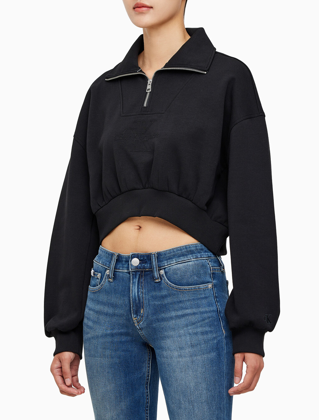 Buy 여성 하프집 엠보스 폴로넥 스웻 in color CK BLACK