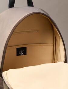 Buy 남녀공용 볼드 로고 컬러블록 라운드 백팩 in color Desert Taupe