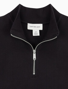 Buy 여성 우븐라벨 슬리브리스 하프 집업 탑 in color BLACK
