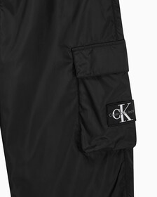 Buy 남성 오버핏 모노그램 카고 팬츠 in color CK BLACK