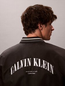 Buy 언필드 나일론 그래픽 봄버 자켓 in color BLACK